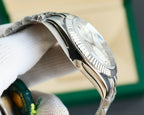 Stainless steel Rolex wristwatch side profile with ridged bezel