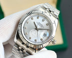 Rolex Datejust wristwatch close-up, silver dial with gold markers and date lens