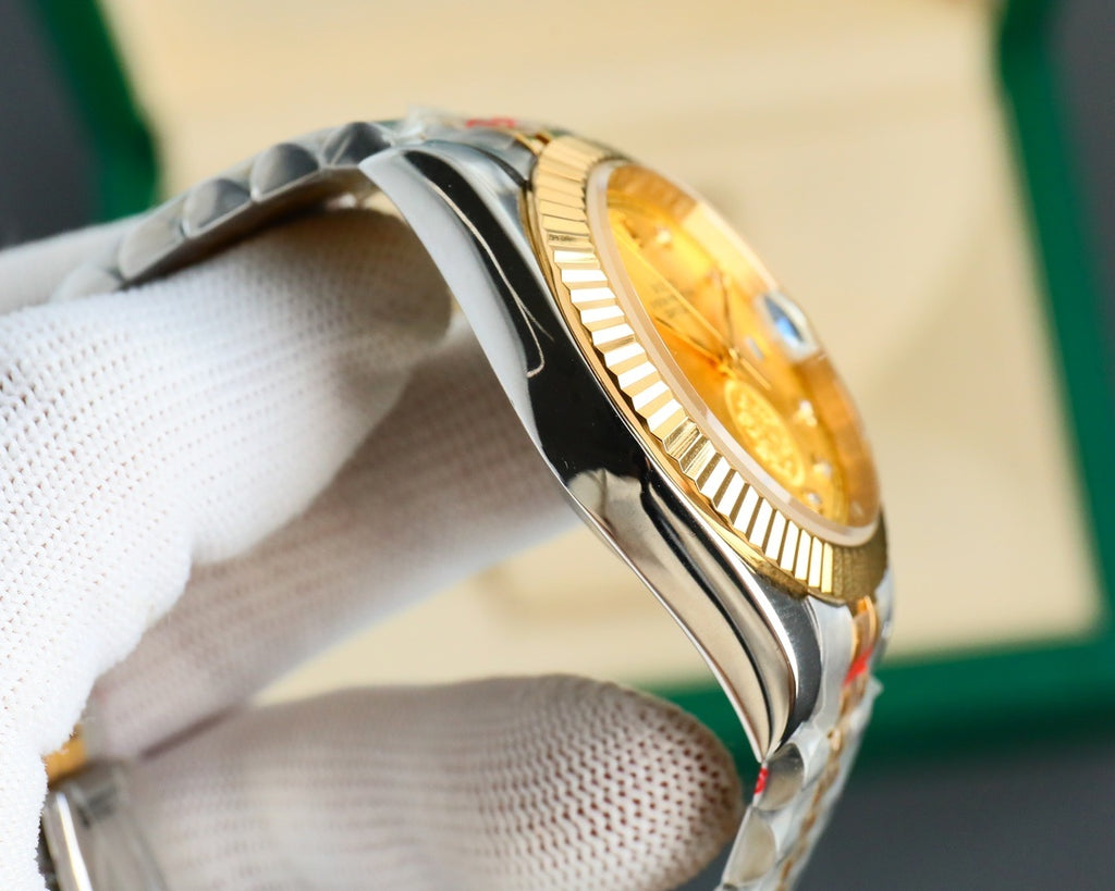 Two-tone wristwatch side view with gold-toned dial window and metal case