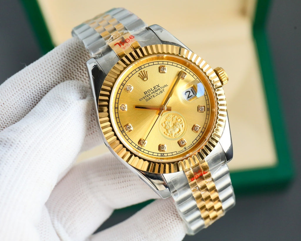 Two-tone wristwatch with gold dial and gold bezel, metal bracelet on hand
