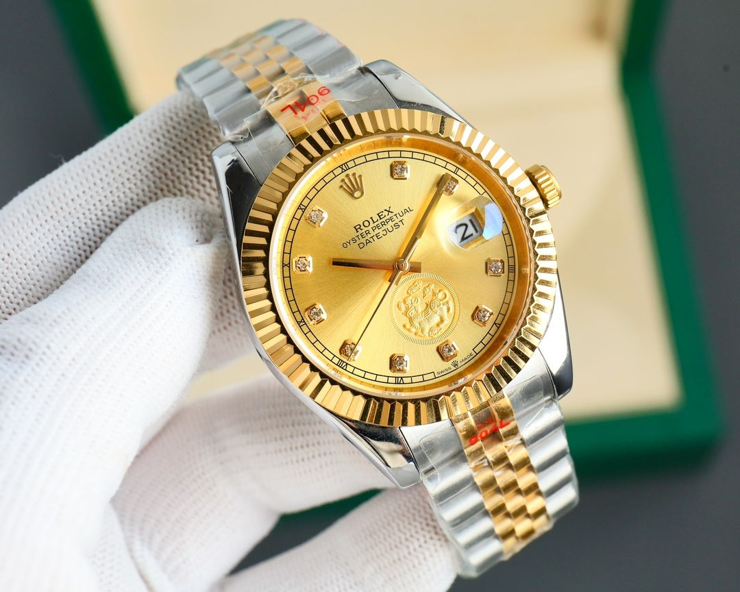 Two-tone wristwatch with gold dial and gold bezel, metal bracelet on hand