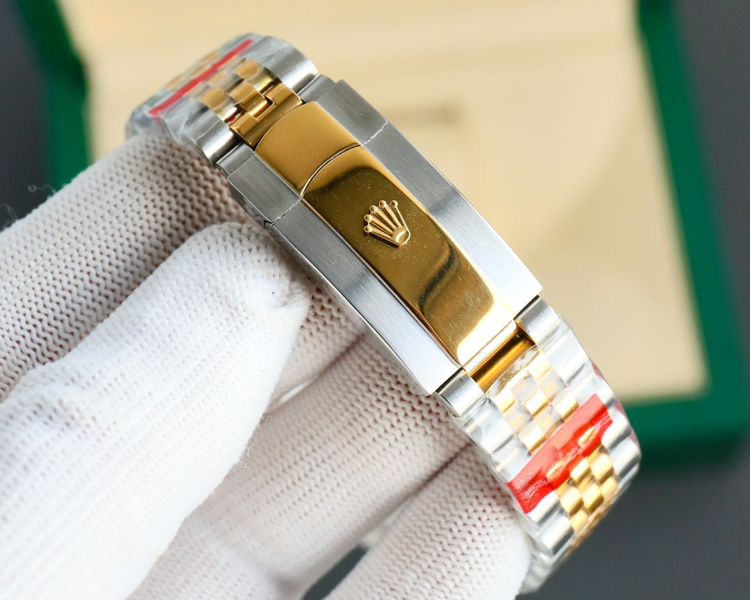 Two-tone wristwatch clasp with gold-toned emblem, metal bracelet links