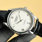 Rolex wristwatch close-up front; white dial, black leather strap, silver bezel