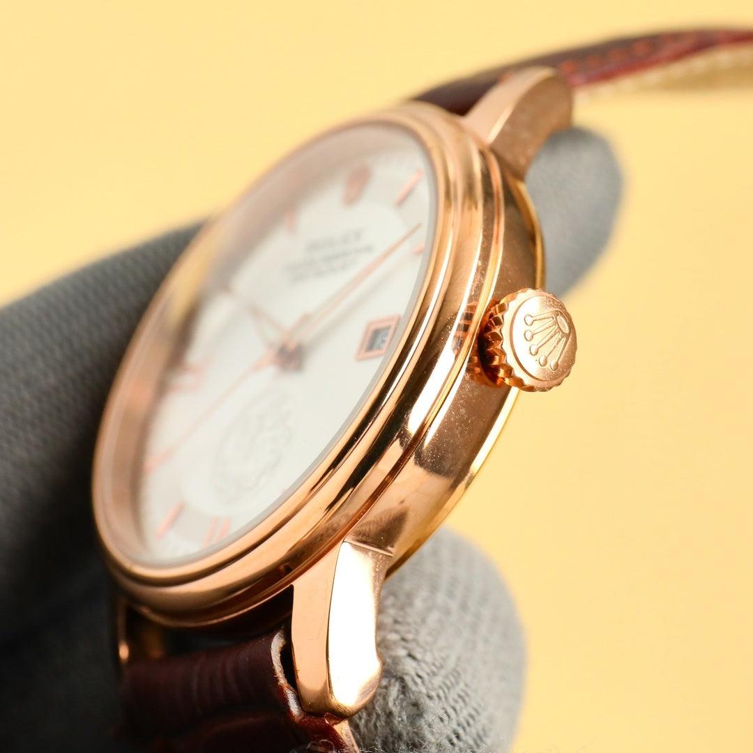 Gold-tone Datejust wristwatch case and crown detail with brown leather strap