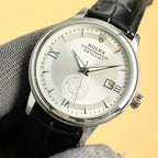 Steel Datejust wristwatch with white dial, date window, black leather strap