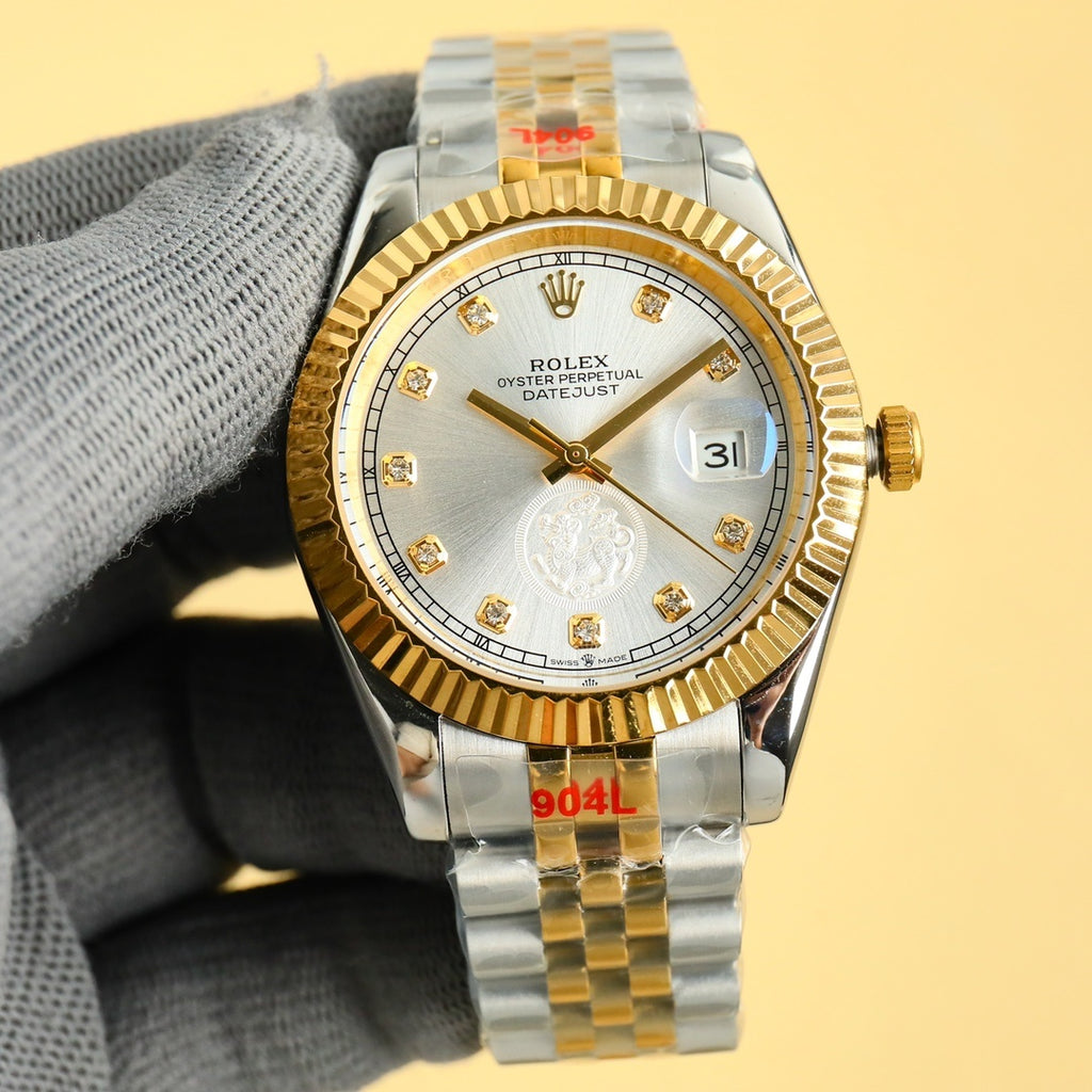Rolex watch with silver-toned dial, gold bezel, two-tone bracelet and date window at 3