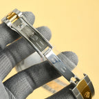 Rolex watch clasp and caseback with engraved text, two-tone metal bracelet