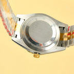 Rolex watch caseback close-up with metal back plate and crown detail