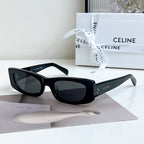 Celine sunglasses, black frame with dark lenses, full-rim cat-eye style.