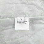 White fabric label reading size S and 100% cotton