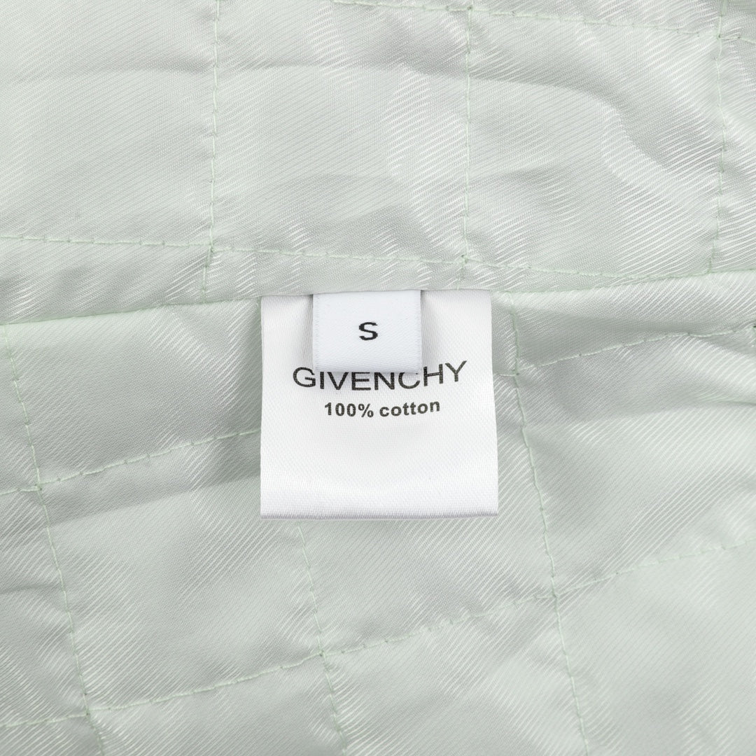 White fabric label reading size S and 100% cotton