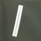 Dark green jacket with white vertical stripe pocket detail