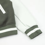 Dark green and white striped ribbed sleeve cuff on varsity jacket