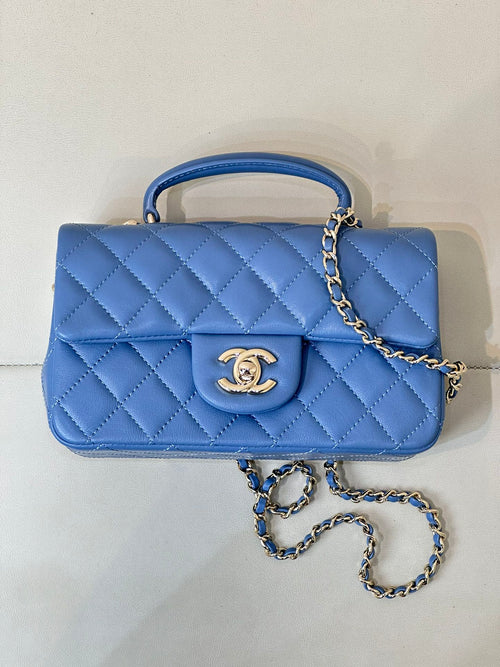 Chanel blue quilted flap handbag with gold CC logo and long chain shoulder strap