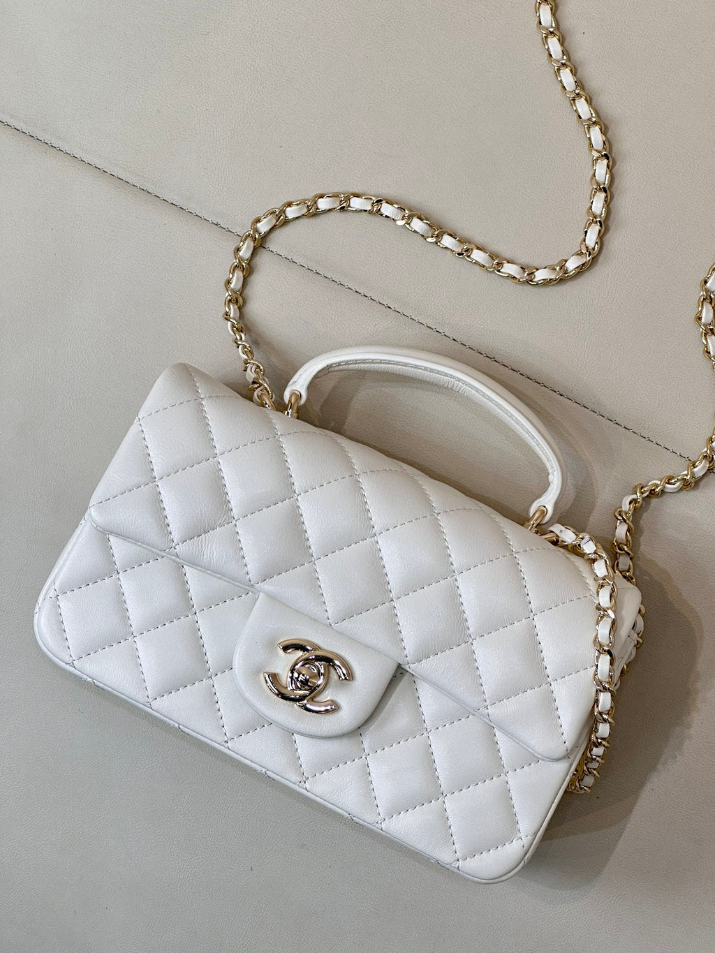 Chanel white quilted mini shoulder bag with chain strap and curved top handle