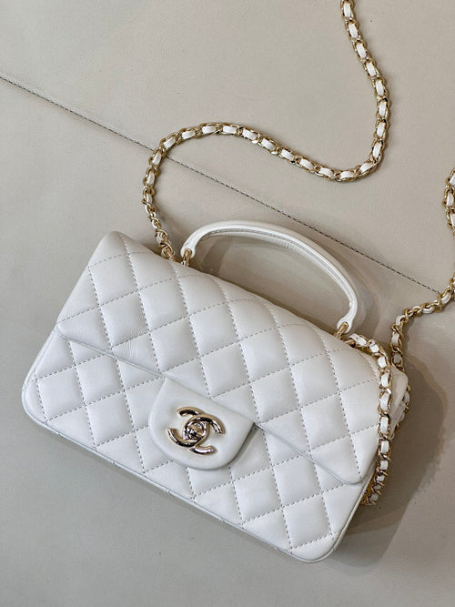 Chanel white quilted mini shoulder bag with chain strap and curved top handle