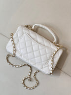Chanel white quilted mini handbag with gold-tone chain strap and logo front panel