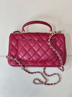 Chanel quilted flap bag back view, maroon-pink leather with chain strap