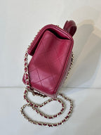 Chanel quilted flap bag side view, maroon-pink leather with chain shoulder strap