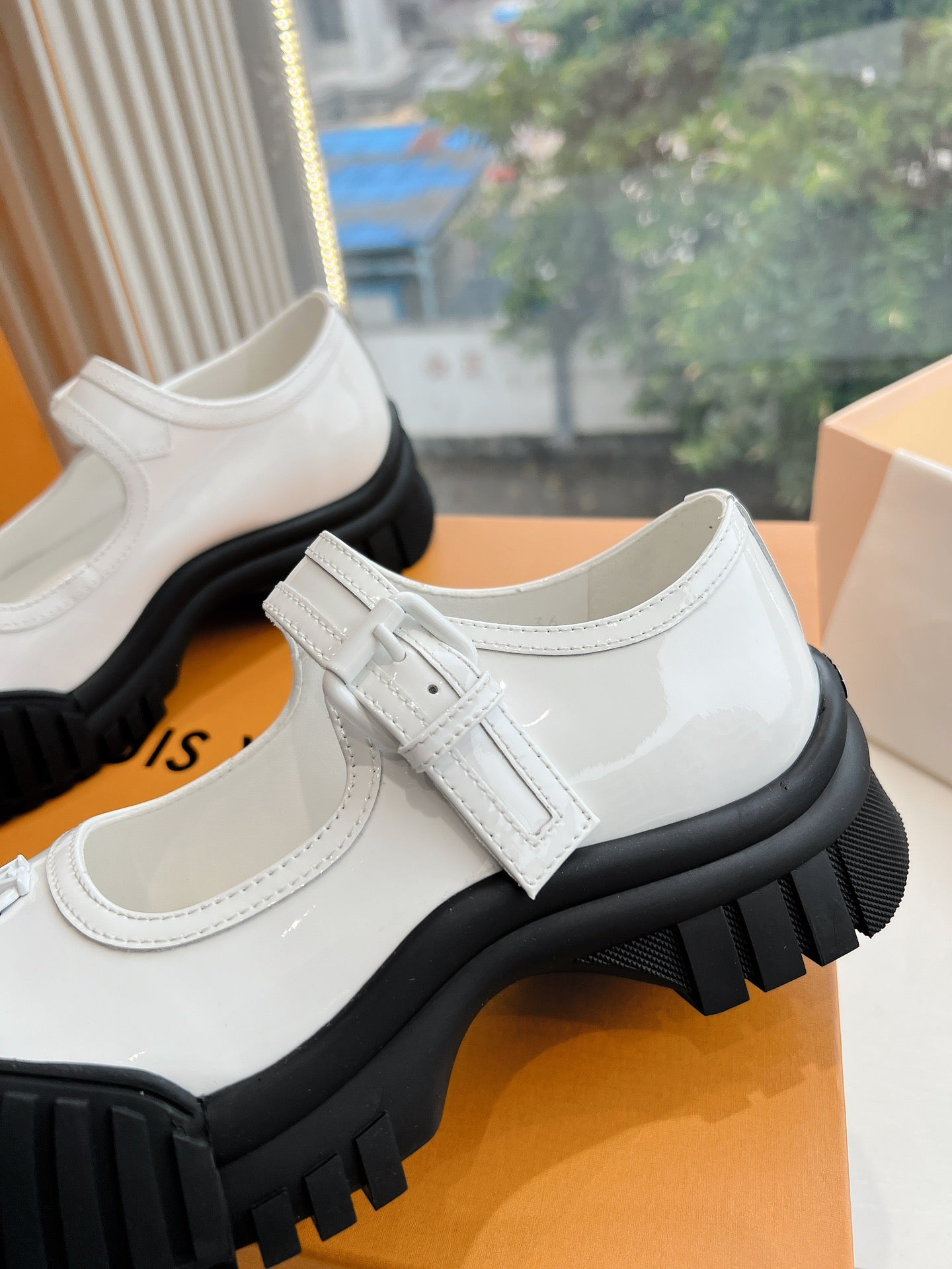White Louis Vuitton unisex sneaker upper detail, strap closure and stitched seams