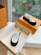 White and black Louis Vuitton unisex sneakers, round toe and chunky tread sole