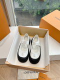 White and black Louis Vuitton unisex sneakers, glossy upper with strap buckle