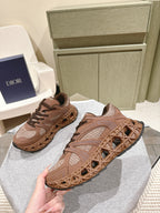 Unisex sneakers with tan mesh upper, brown laces, and textured trail sole