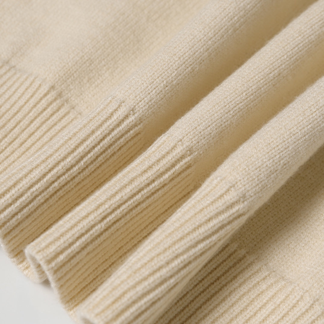 Light beige ribbed knit texture detail on sweater cuff