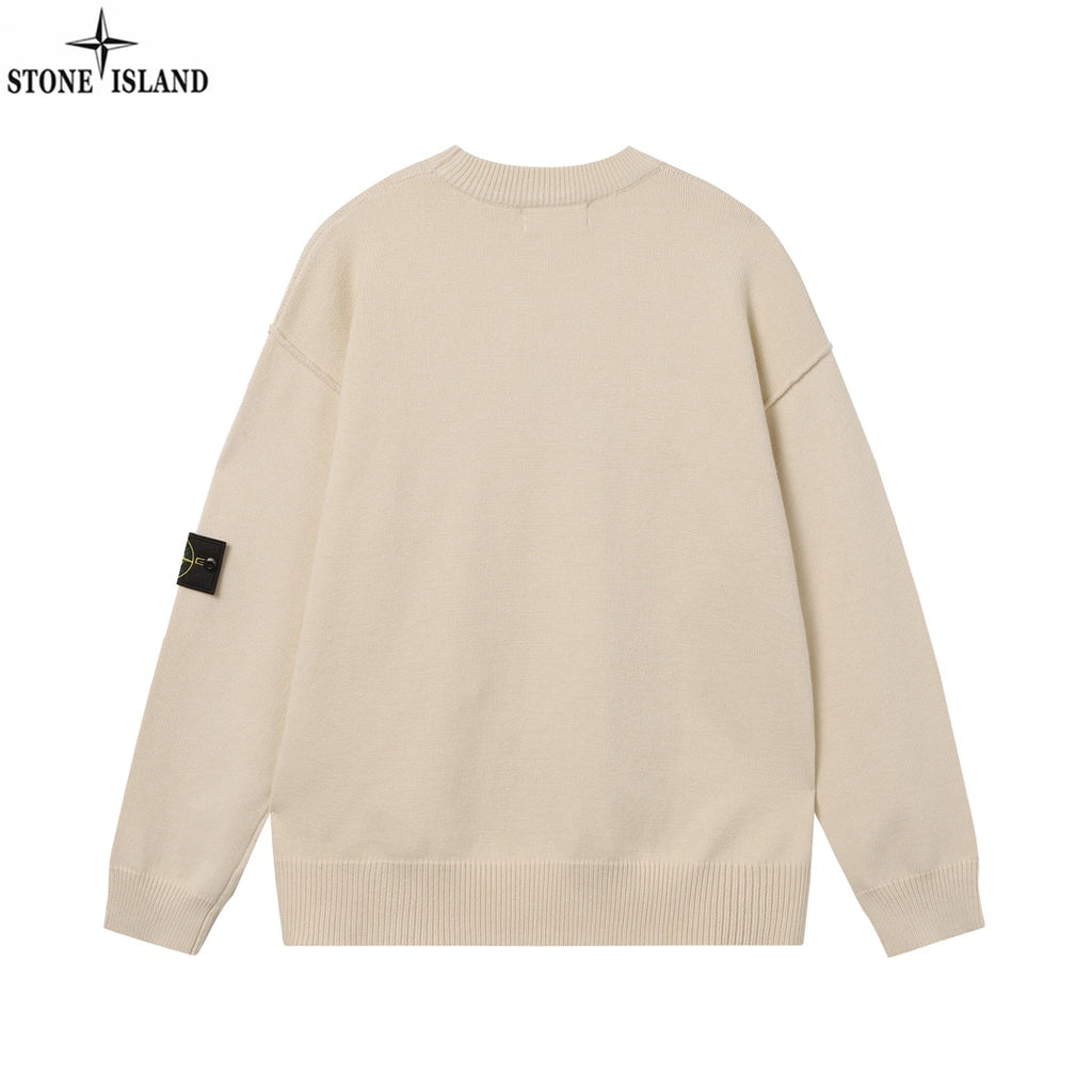 Light beige crewneck knit sweater with ribbed hem and sleeve badge, back view
