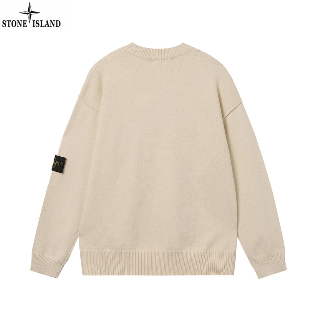 Light beige crewneck knit sweater with ribbed hem and sleeve badge, back view