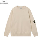 Light beige crewneck knit sweater with ribbed cuffs and hem, Stone Island sleeve badge