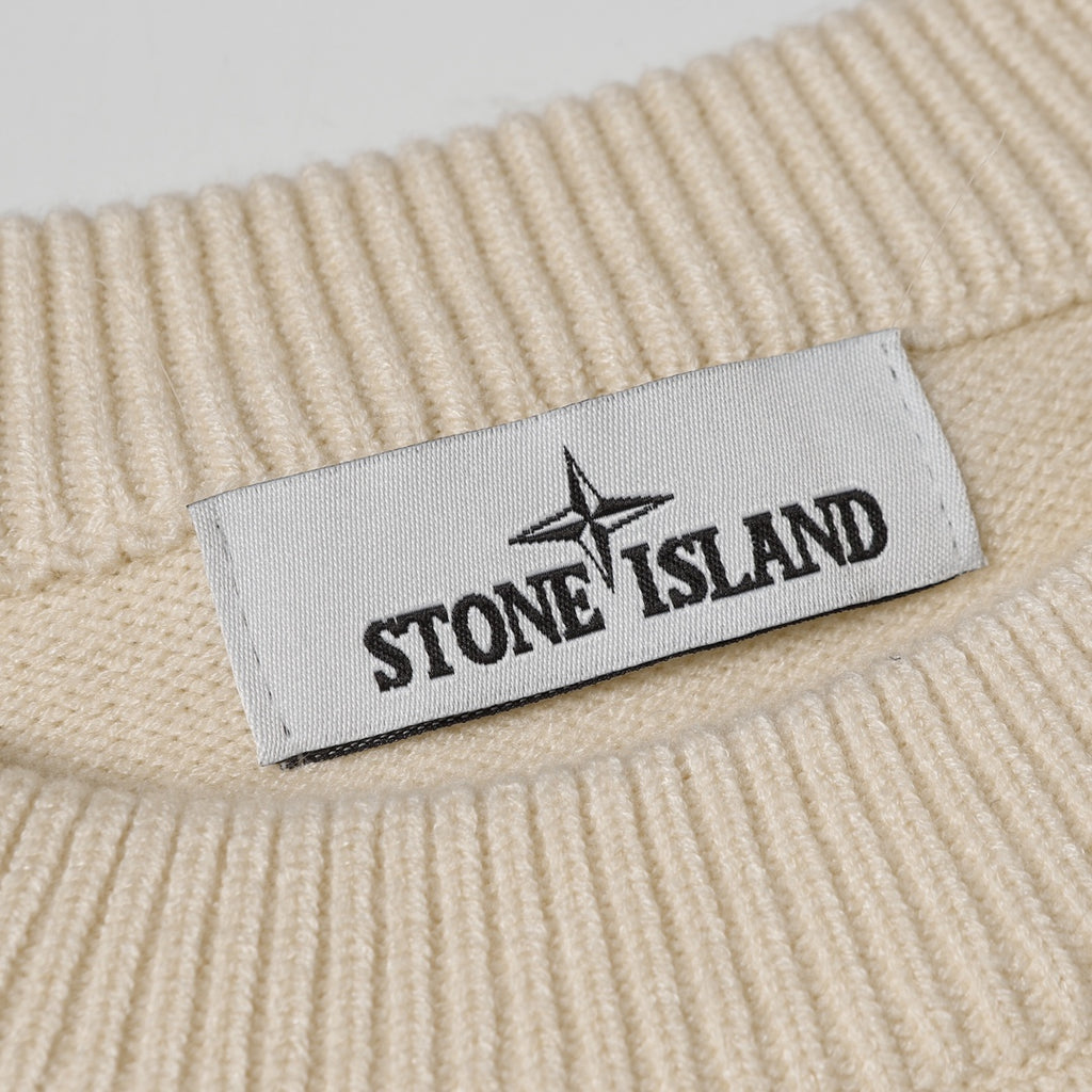 Stone Island woven size label on light beige ribbed knit sweater