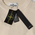 Stone Island crewneck sweater collar with brand label and hanging black tag