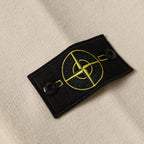 Black Stone Island logo patch with yellow emblem and two black snaps