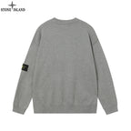 Stone Island knit crewneck sweater in gray from the back, with logo patch on sleeve