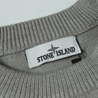 Stone Island logo label on ribbed neckline of gray crewneck knit sweater