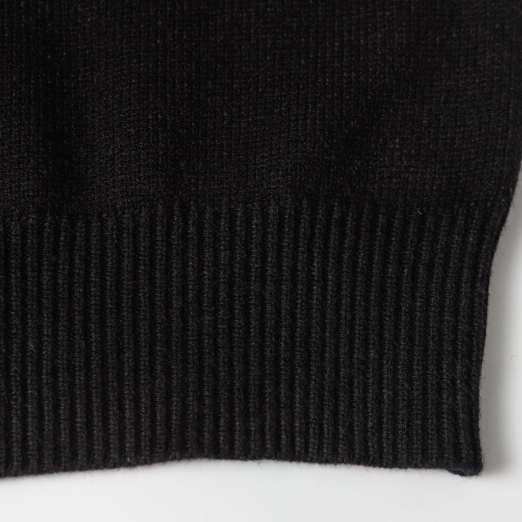 Black knit sweater ribbed cuff edge