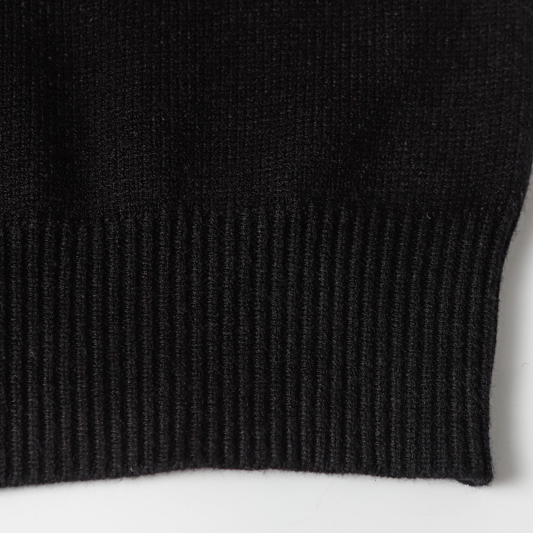 Black knit sweater ribbed cuff edge