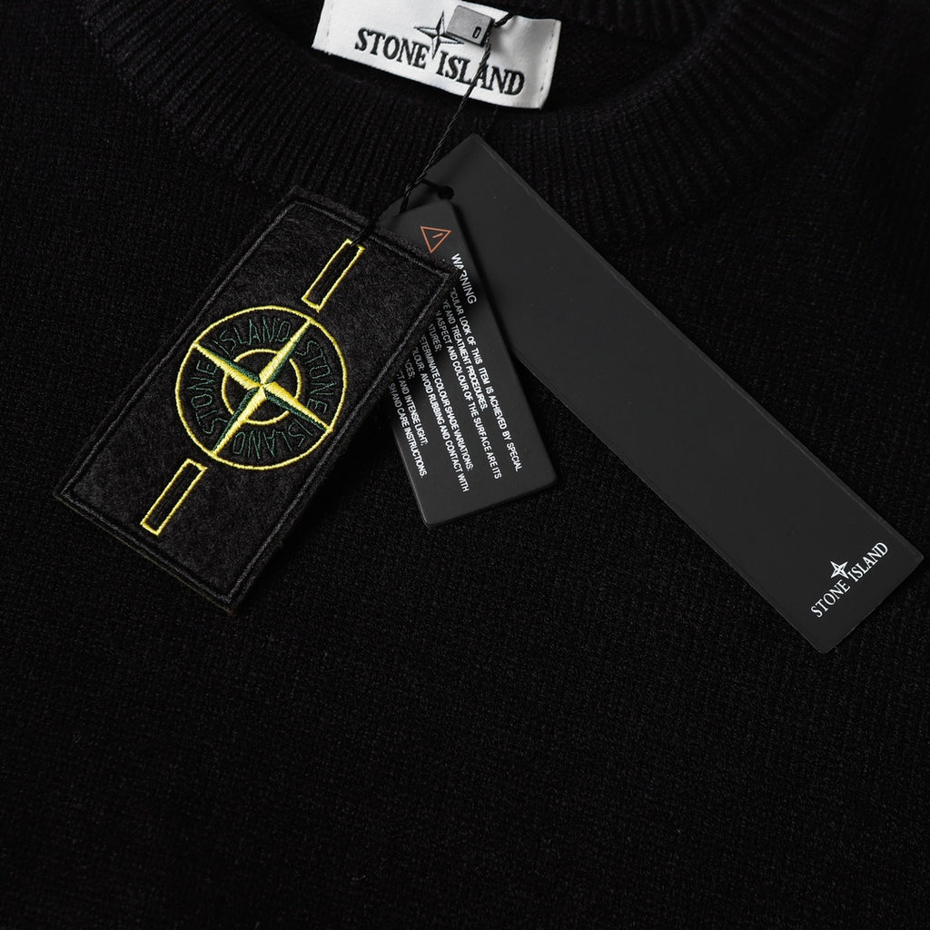 Black knit sweater neckline with Stone Island tag and care labels