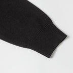 Black knit sweater ribbed sleeve cuff