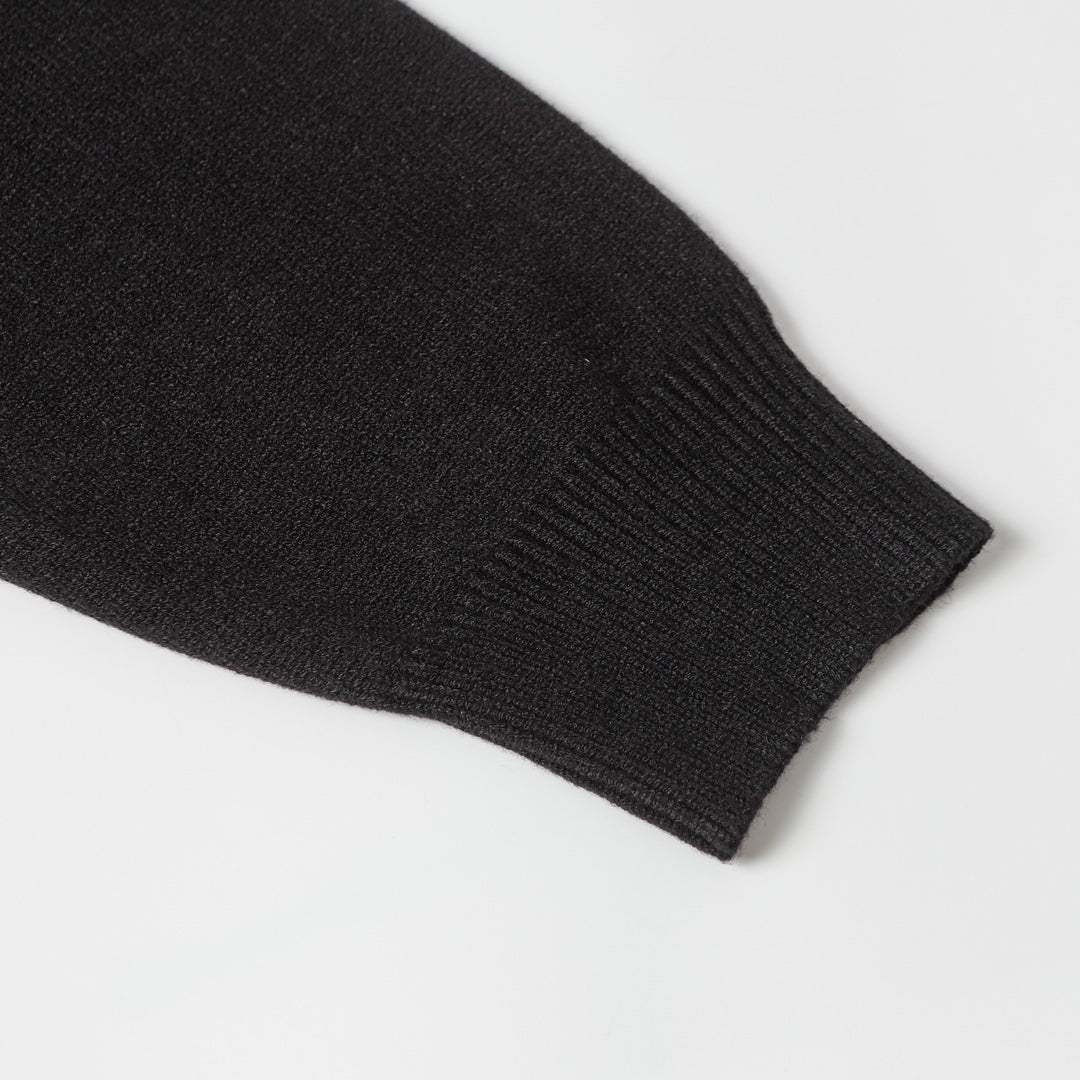Black knit sweater ribbed sleeve cuff