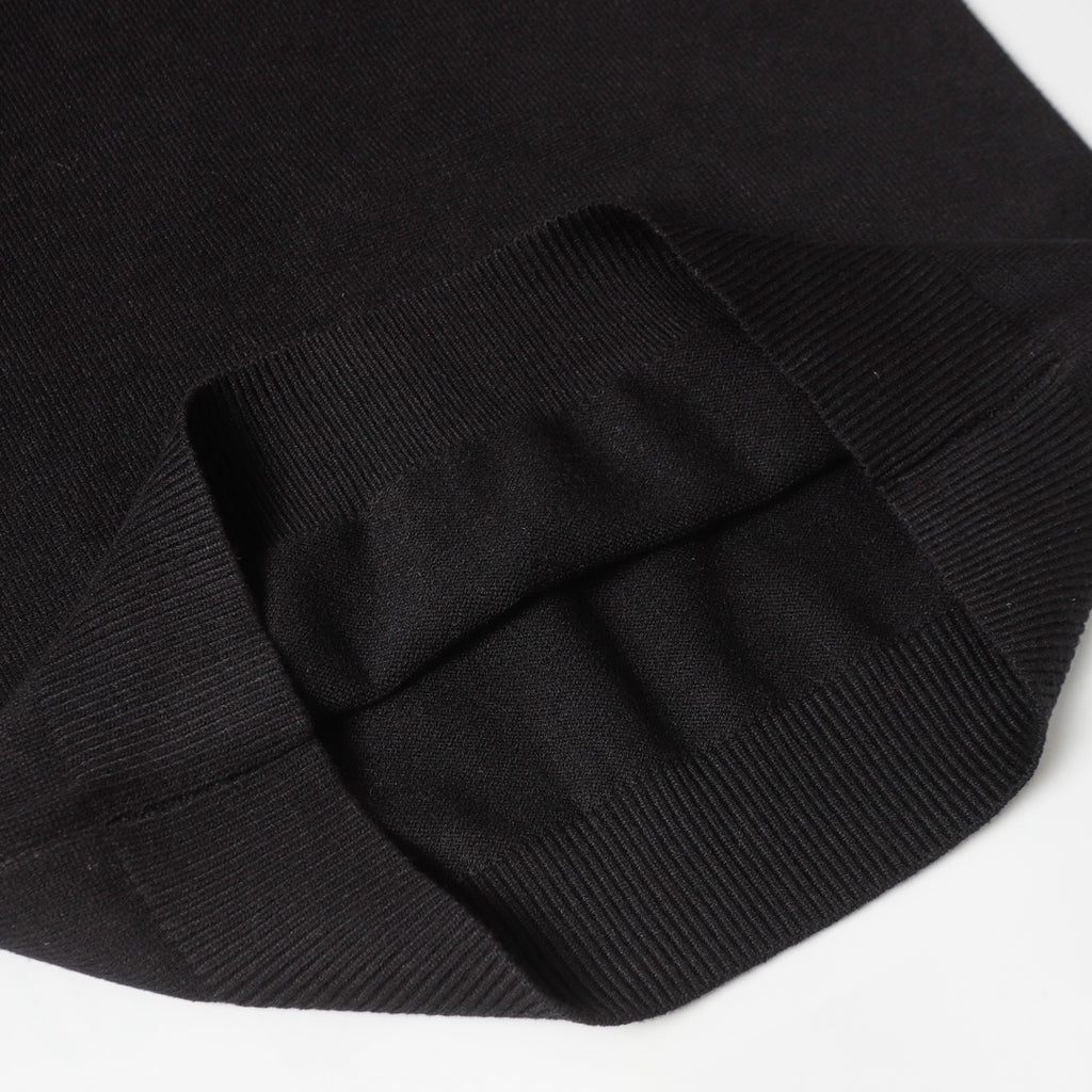 Black knit sweater folded sleeve cuff detail with ribbing