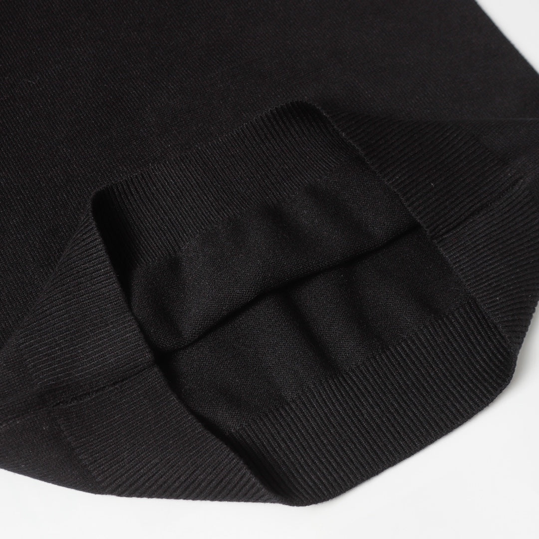 Black knit sweater folded sleeve cuff detail with ribbing