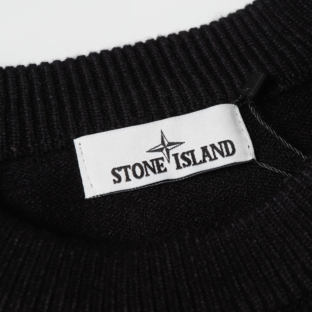 Black knit sweater collar with Stone Island logo label