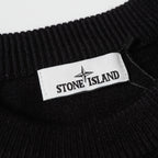 Black knit sweater collar with Stone Island logo label