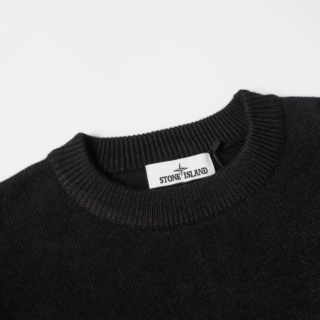 Black crewneck sweater with Stone Island neck label