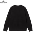 Black crewneck knit sweater with small sleeve patch