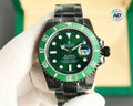 Rolex watch with green dial, black bezel markers, black link bracelet