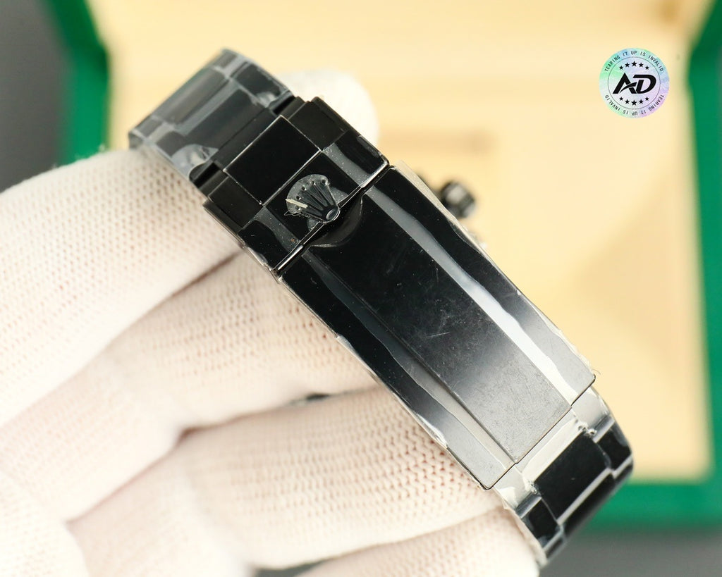 Rolex watch with black link bracelet and metal clasp, side profile