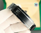 Rolex watch with black link bracelet and metal clasp, side profile